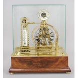 Ball movement clock under a glass lintel on a mahogany wooden base, c. 1840?? unidentified