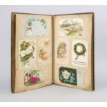 Album with 176 postcards, motifs around 1920/30, mainly kitsch motifs, New Year's greetings etc.