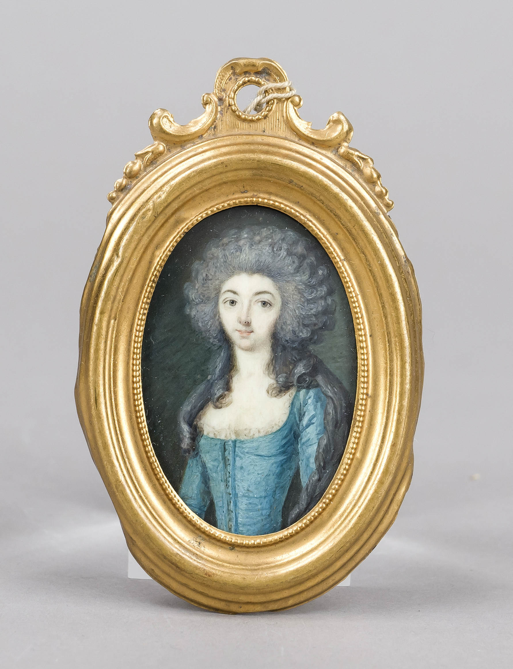 Oval miniature, French c. 1785, polychrome tempera painting on a bone plate. Young woman with