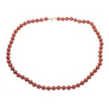 Coral necklace made of 62 fine coral spheres 8.7 mm in a strong, slightly orange-tinged red, with