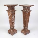 Pair of flower columns, 20th century, polished red stone with natural pattern, conical smooth