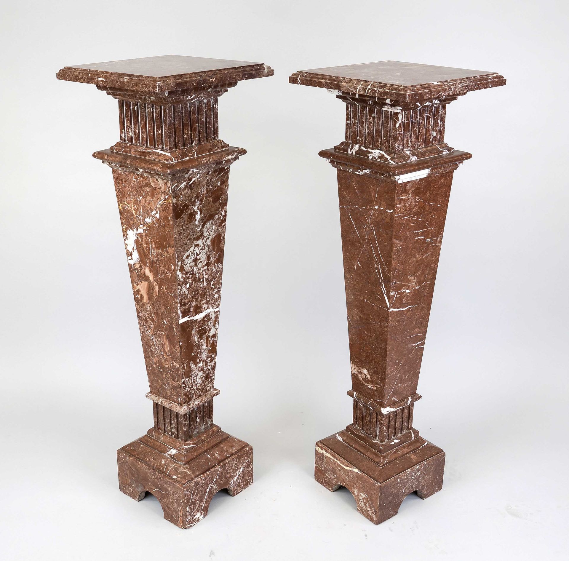 Pair of flower columns, 20th century, polished red stone with natural pattern, conical smooth