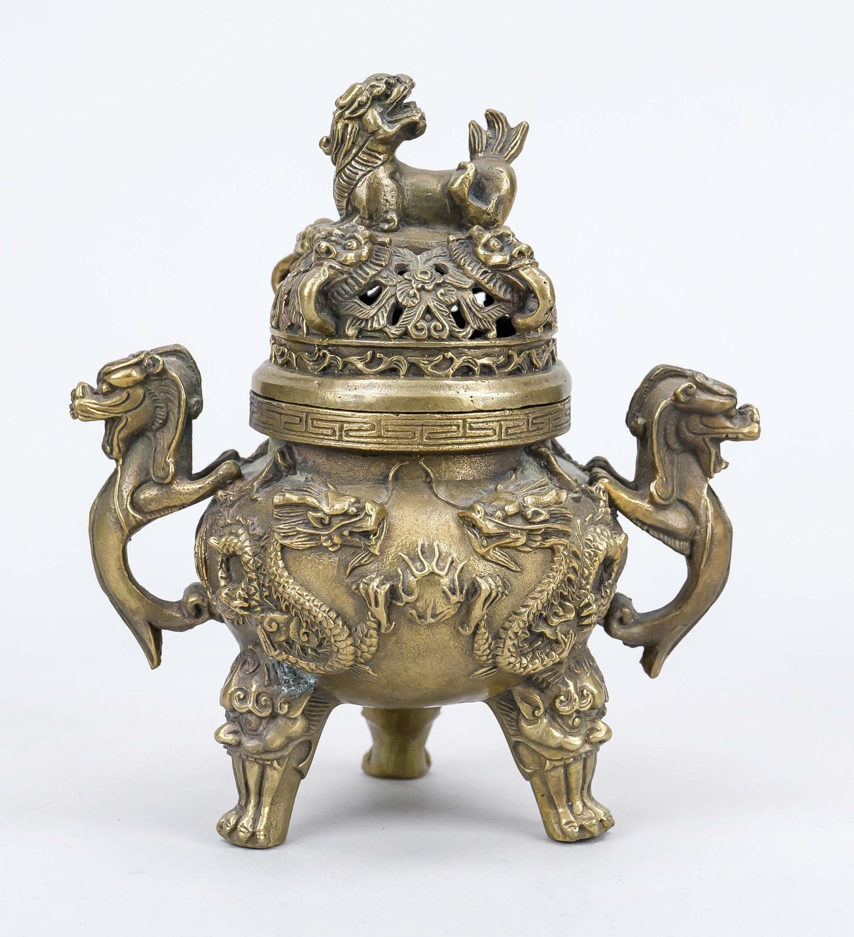 Censer, China 20th century, brass/bronze. Tripod with relief decoration, dragon handles. Openwork