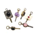 6 antique pocket watch keys, 19th century, gold-plated, with up to 3 stones in the head, amethyst,