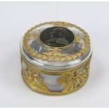 Napoleon lidded box, c. 1900, glass with brass relief, various antique-style depictions, lions