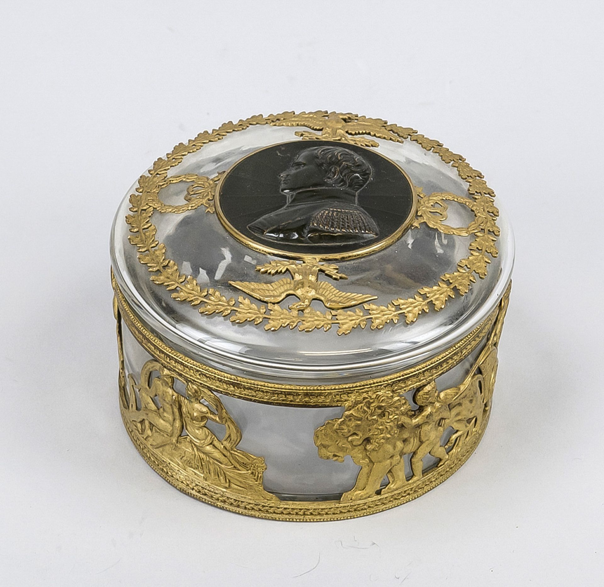 Napoleon lidded box, c. 1900, glass with brass relief, various antique-style depictions, lions