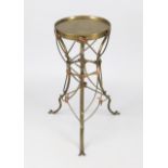 Art Nouveau plant table, c. 1900, brass and copper. Tripod base with leafy tendril. Round top,