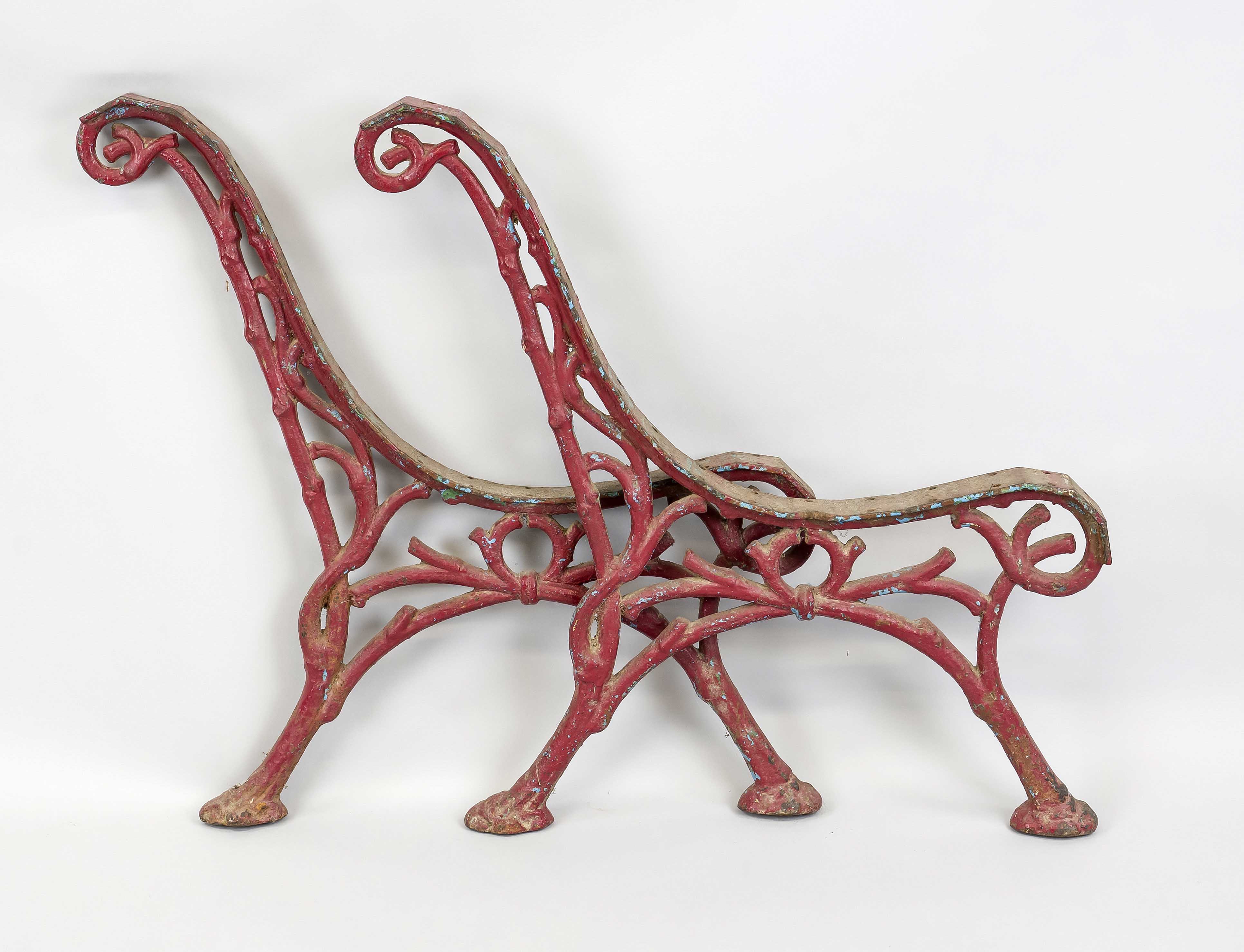 Frame for a garden bench, late 19th century, cast iron painted red. Frame as a branch, rubbed &