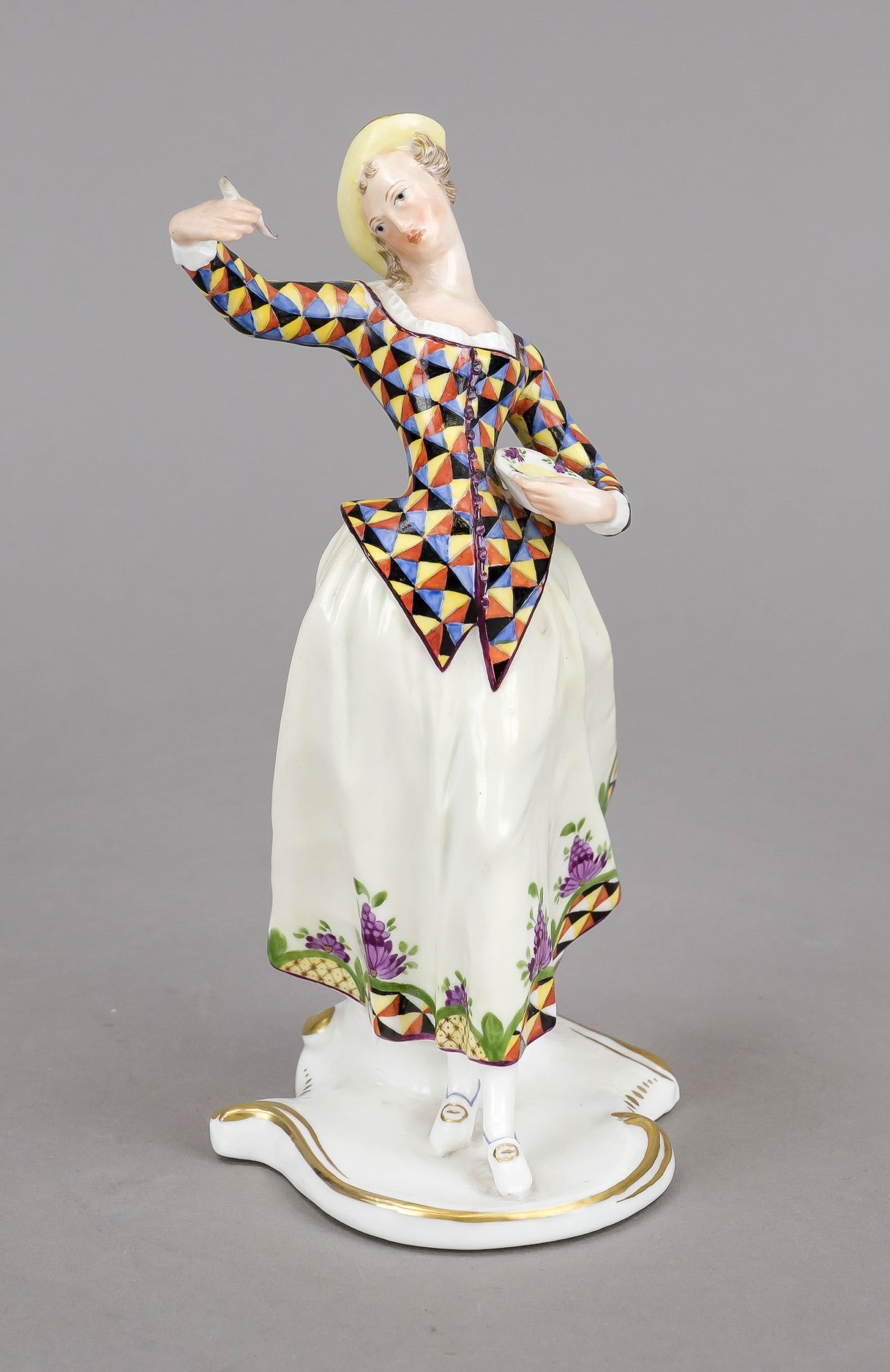 Lalage, Nymphenburg, early 20th century, a dancer holding a broad plate and spoon, from the