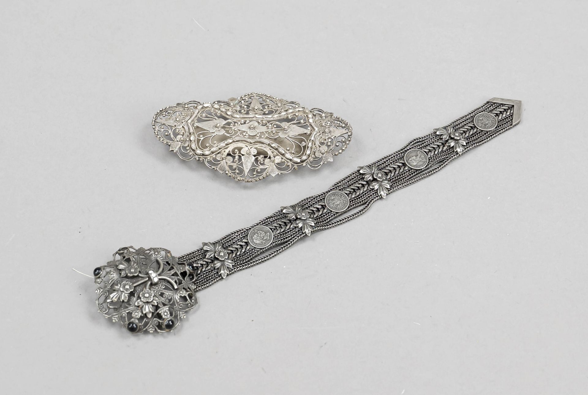 Two Pieces of Traditional Costume Jewelry, 20th century, silver tested or plated, pin with