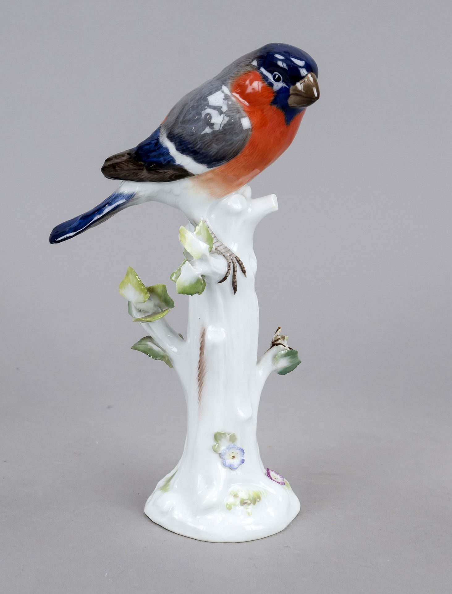 Bullfinch on a tree stump, Meissen, mark 1924-1934, designed by Johann Joachim Kaendler in 1747,