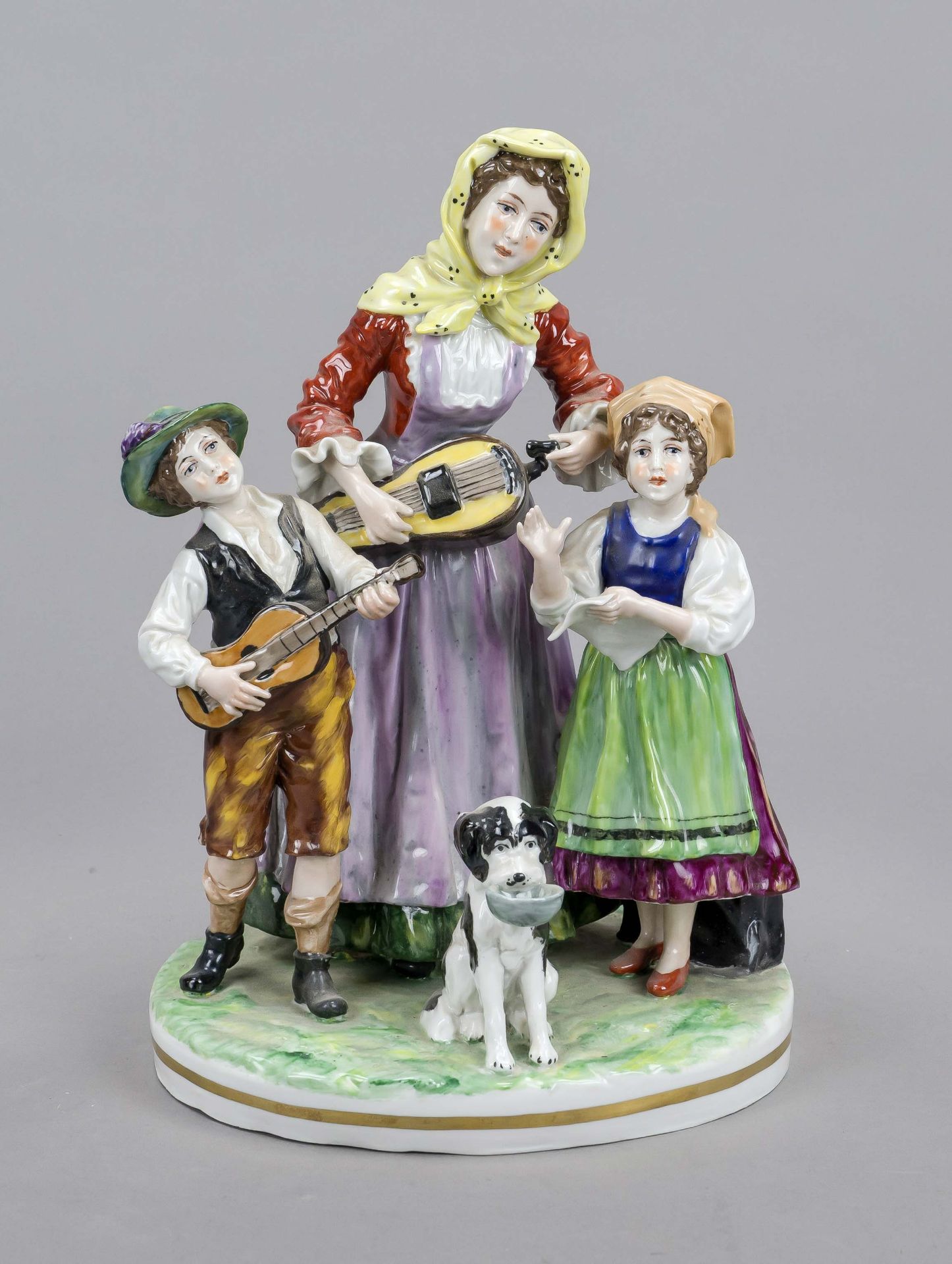 Group of musicians, Thuringia, Rudolstadt, 20th century, mother with hurdy-gurdy, accompanied by her