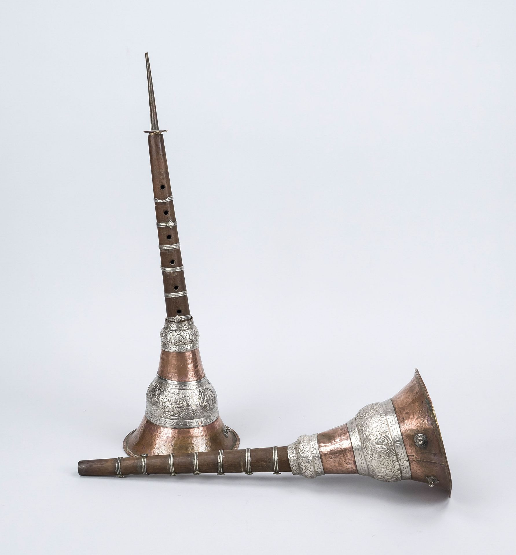 2 wind instruments, Tibet 19th/20th century, copper and white metal, dark wood flute, rubbed and