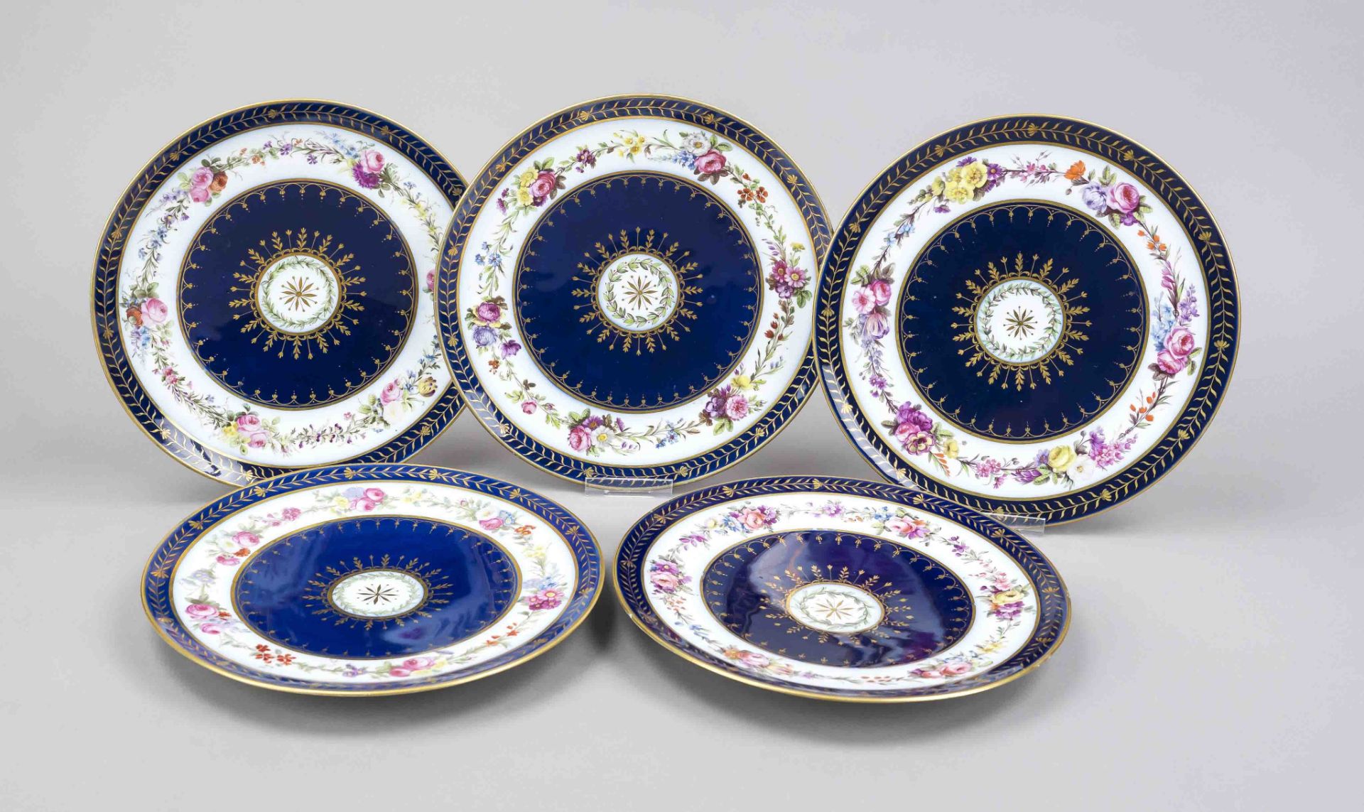 Five plates, France, marked Sevres, flat plate, central rosette surrounded by laurel garland and