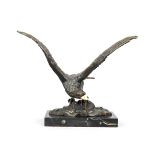 Anonymous sculptor, c. 1920, eagle with spread wings on a rock base, patinated bronze with bone beak