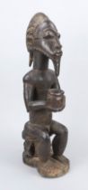 Fetish figure, probably Congo, 19th/20th century, dark hardwood. Openwork, remains of old paint,