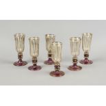 Six liqueur glasses, 20th century, round disk stand, jointed stem, cylindrical body, clear glass,