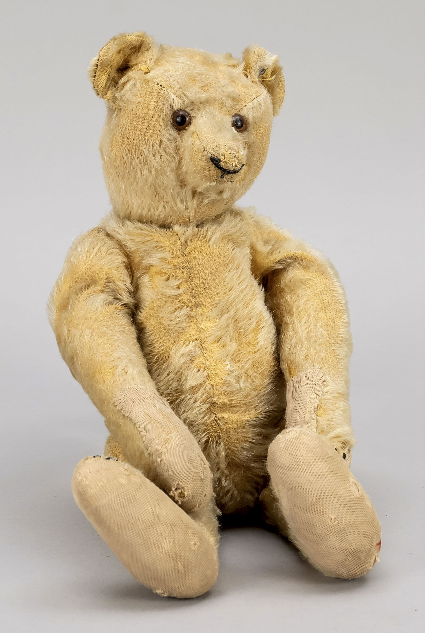 Steiff teddy bear, Germany, around 1905, movable arms and legs. Mended here and there, heavy fur