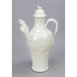 Blanc de Chine teapot, China (Dehua) 19th/20th century Slender body with relief decoration, loop