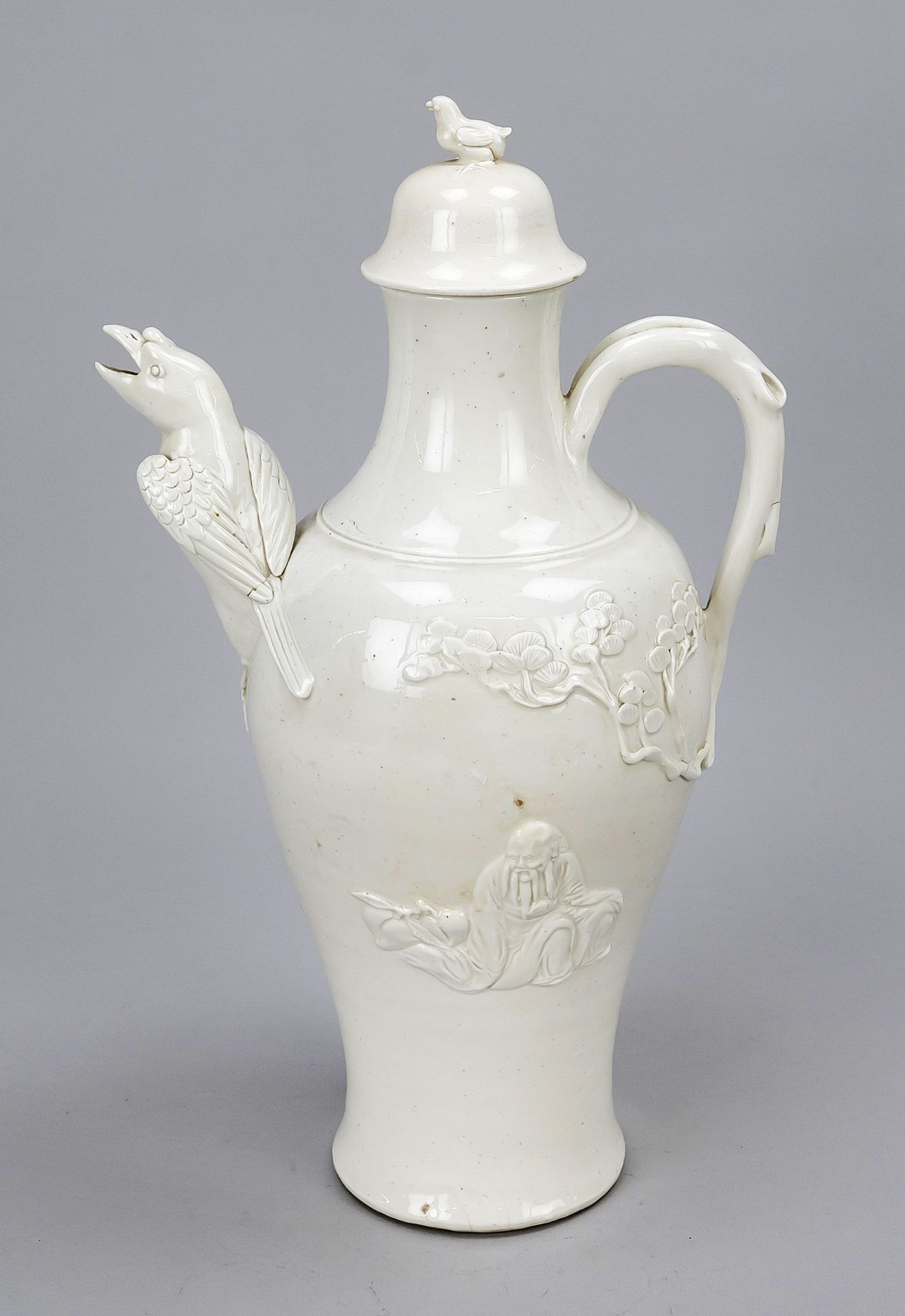 Blanc de Chine teapot, China (Dehua) 19th/20th century Slender body with relief decoration, loop