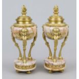 Pair of side plates, France 19th century, pink marble with gilt bronze applications, round plinth on