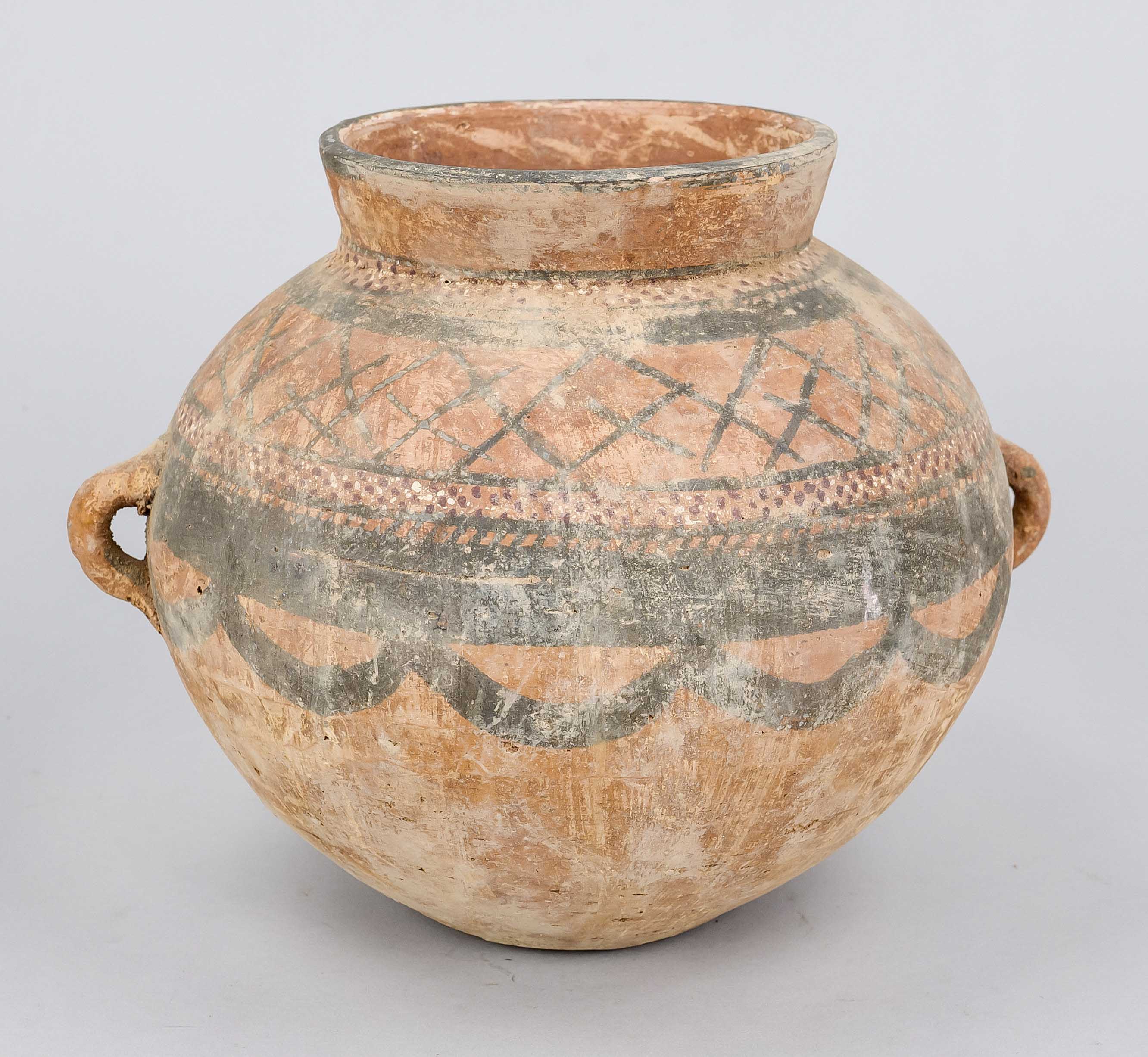 Pot with small loop handles, China, probably Han period. Bellied vessel of reddish body with