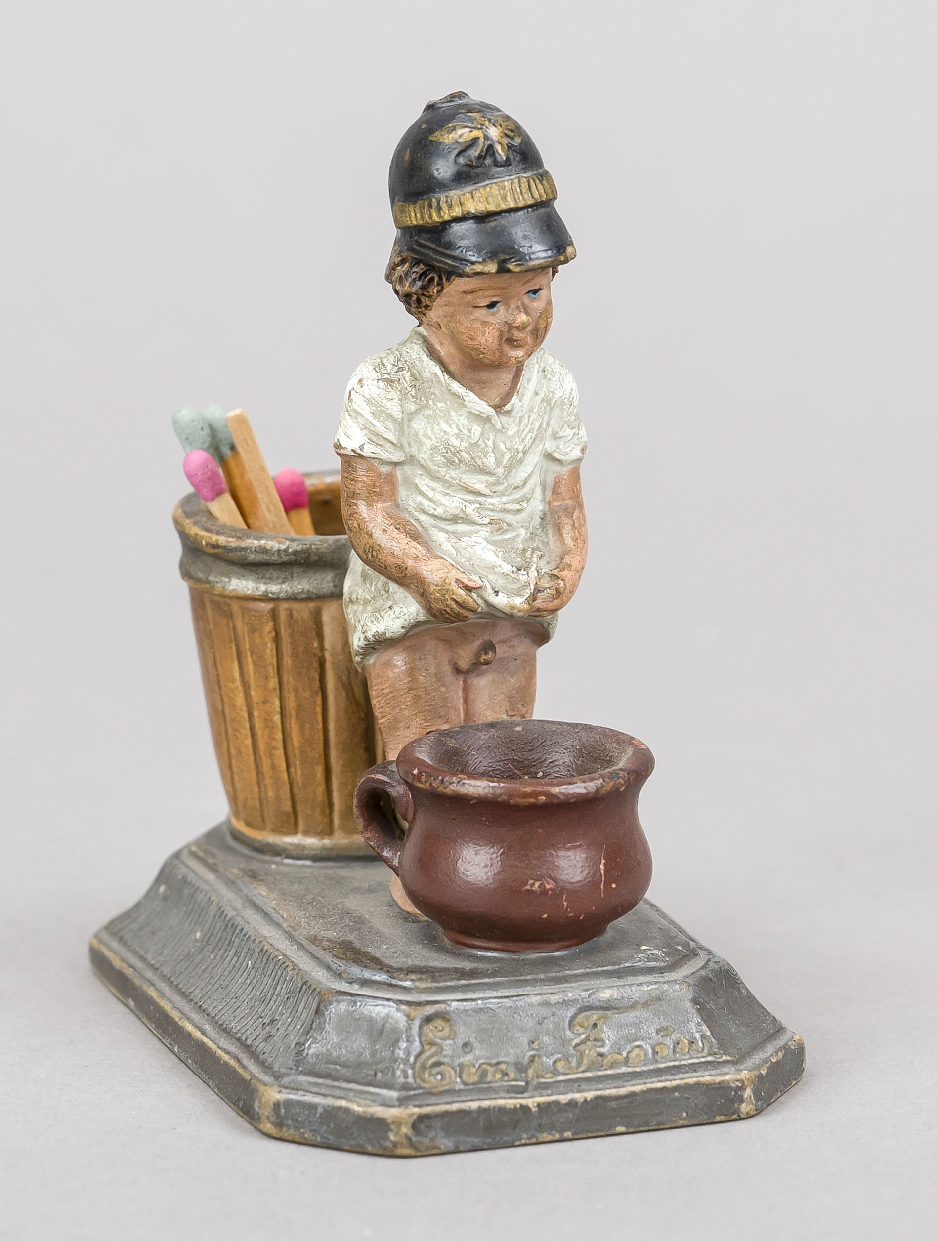 Humorous match holder, late 19th century, polychrome painted and glazed stoneware. Little boy in a