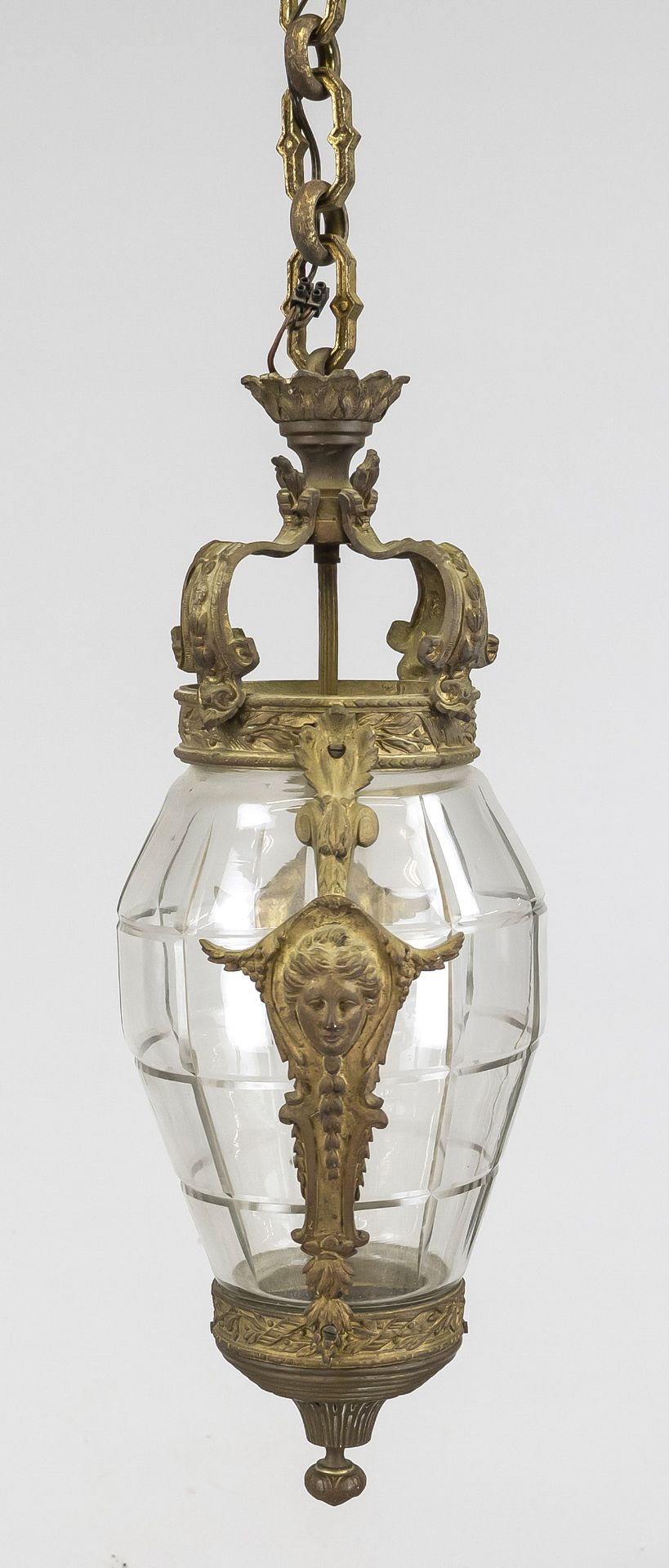 Ceiling lantern, late 19th century, faceted glass body in ornamented frame with mascarons and crown.