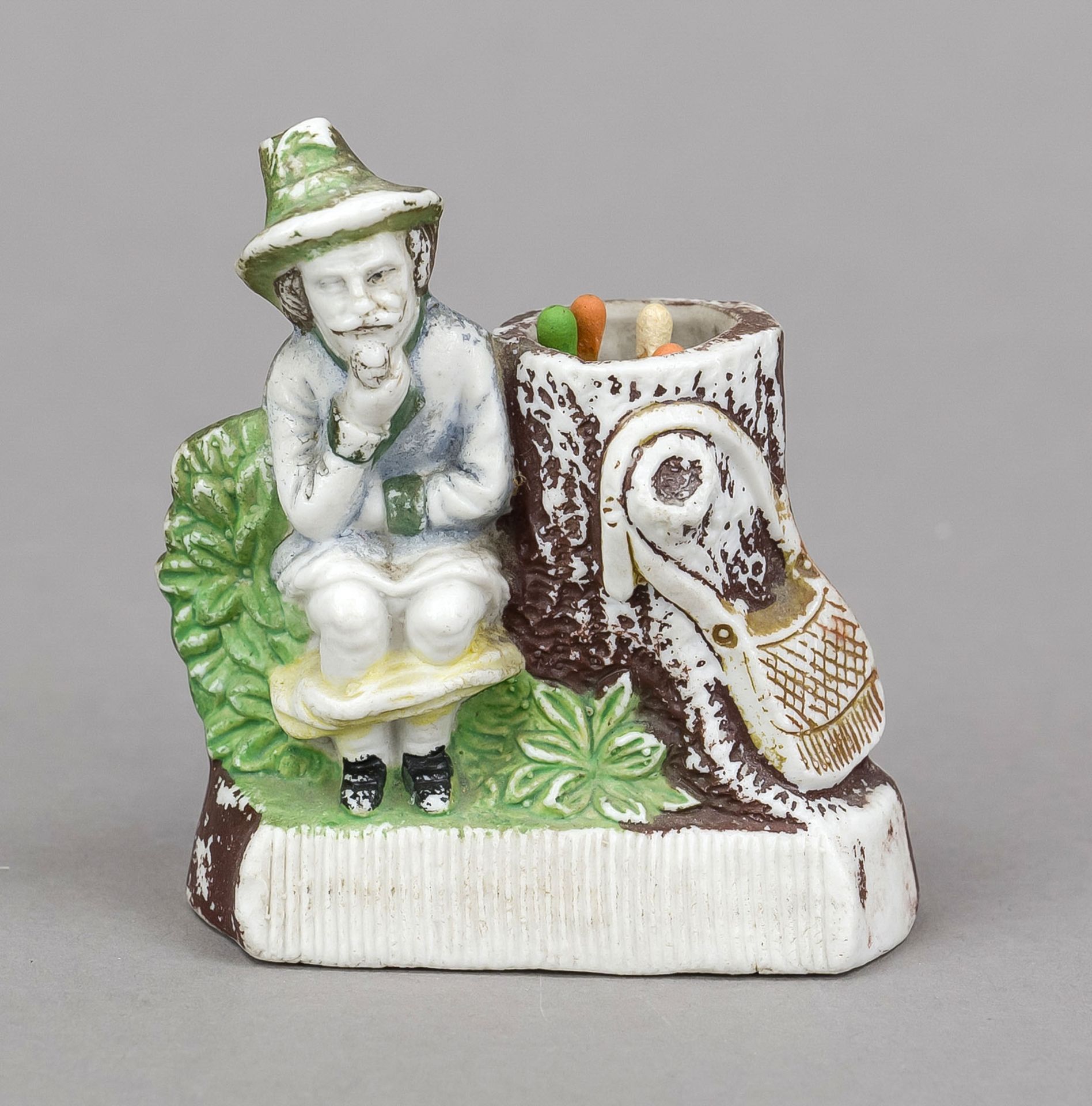 Humorous match holder, late 19th century, polychrome painted bisque porcelain. Hunter doing his