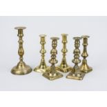 6 candlesticks, 19th century, brass. All balustrated, slightly rubbed, h. up to 24 cm