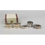 Four napkin rings, 20th century, various makers, silver of different finenesses, various shapes