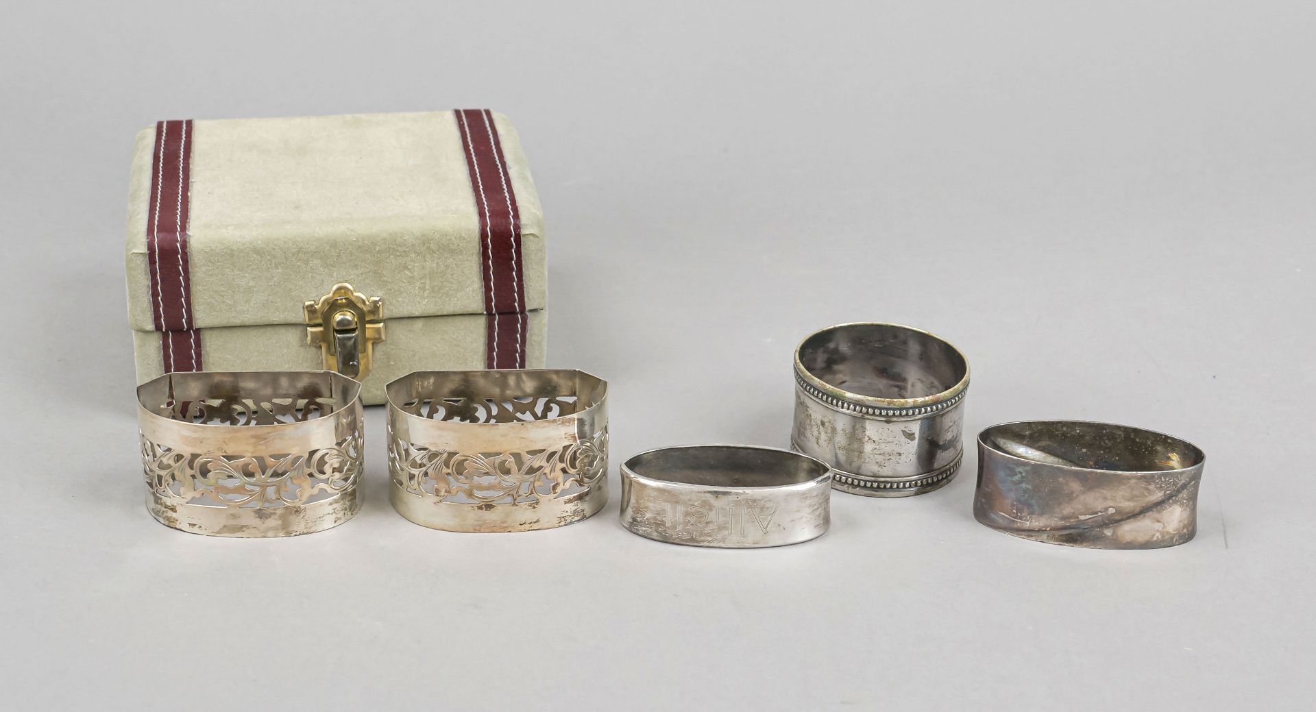 Four napkin rings, 20th century, various makers, silver of different finenesses, various shapes