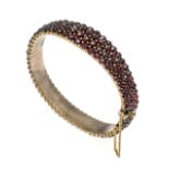 Garnet hinged bangle, gold-plated metal, with round faceted garnets 4 - 2 mm, box clasp with SI