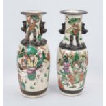 Pair of vases, China late 19th century (Qing). Revolving decoration with warriors, pseudo-bronze