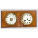 Barometer, thermometer and glass clock screwed crosswise onto a mahogany board, inscribed ''Schatz -