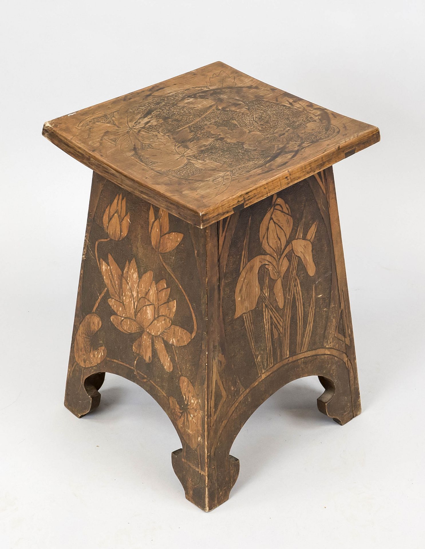 Art Nouveau stool, Germany, c. 1900, wood with cut vegetal decoration, slightly curved top, stable