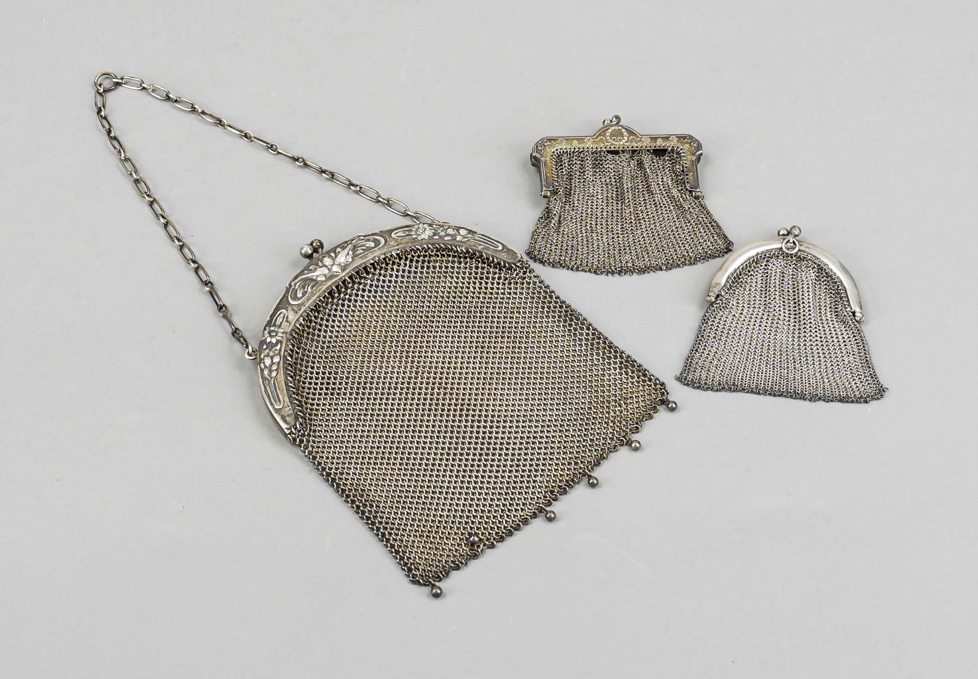 A small purse and two wallets, hallmarked Russia, silver of various finenesses or tested, various