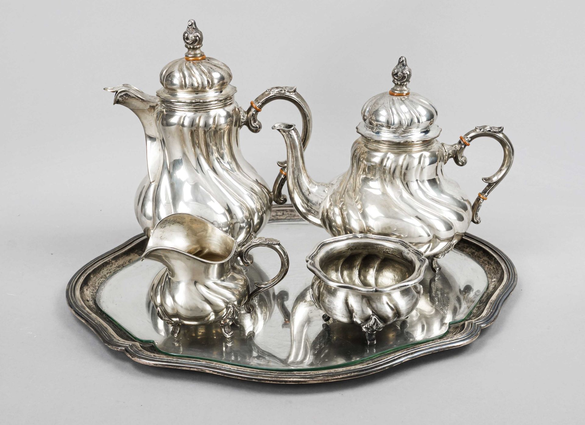 A four-piece coffee and tea set on an oval tray, German, 20th century, silver 800/000, the