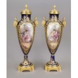 A pair of Sevres-style ceremonial vases, France, 20th century, ovoid body on a round foot, elaborate