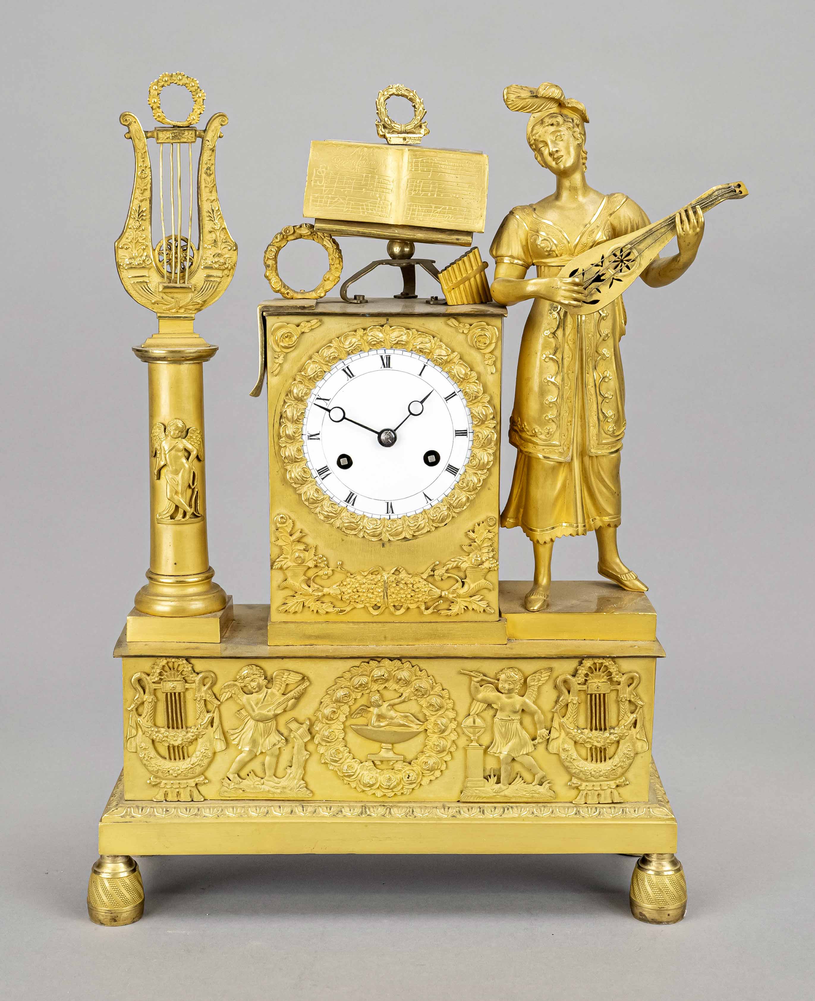 Empire pendulum, 1st half 19th century, fire-gilt bronze, a woman surrounded by musical