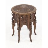 Side table, Southeast Asia, 20th century, dark hardwood. Round, elaborately carved top on a