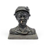 Figural cast iron inkwell, c. 1900, head of a boy with cigarette, hat hinged, underneath an