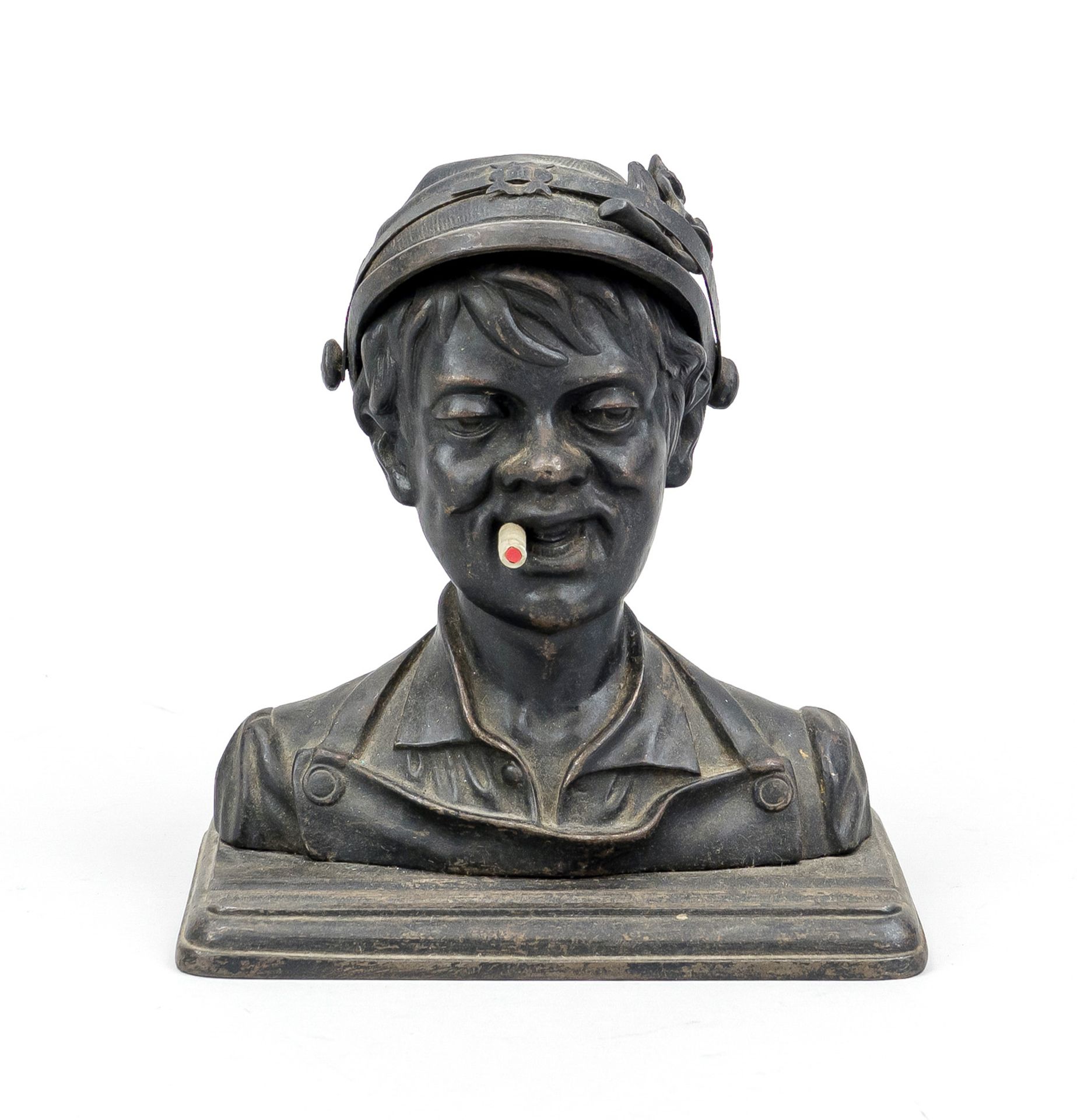 Figural cast iron inkwell, c. 1900, head of a boy with cigarette, hat hinged, underneath an