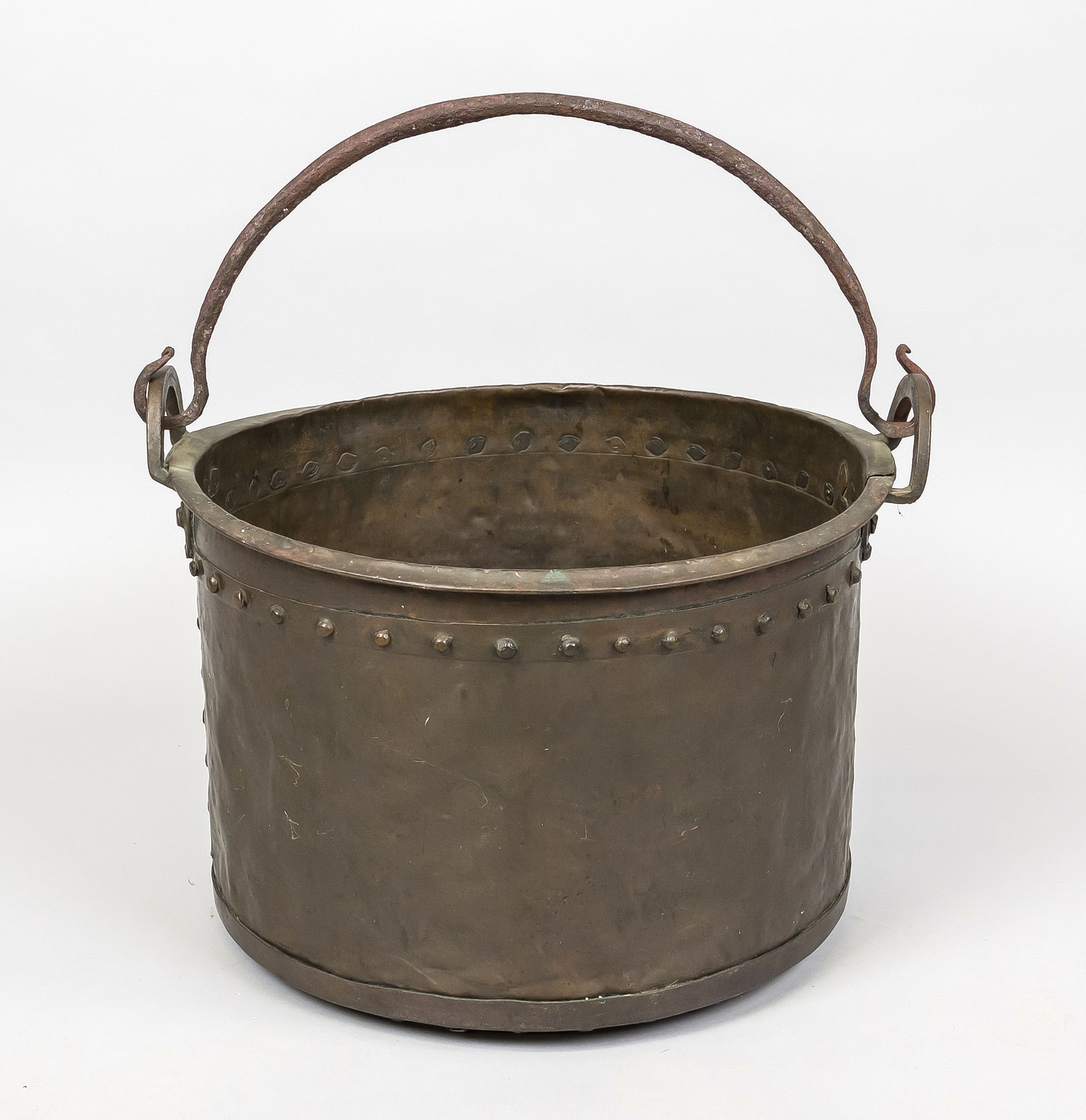 Large cauldron, 18th century, copper. Cylindrical form with studded belt, pivoting iron handle,