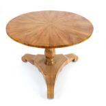 Round Biedermeier table, circa 1830, cherry wood, triangular curved base, restored, h. 78 cm, d. 110