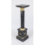 Flower column/pedestal, 20th century, polished black stone with natural pattern, brass applications,