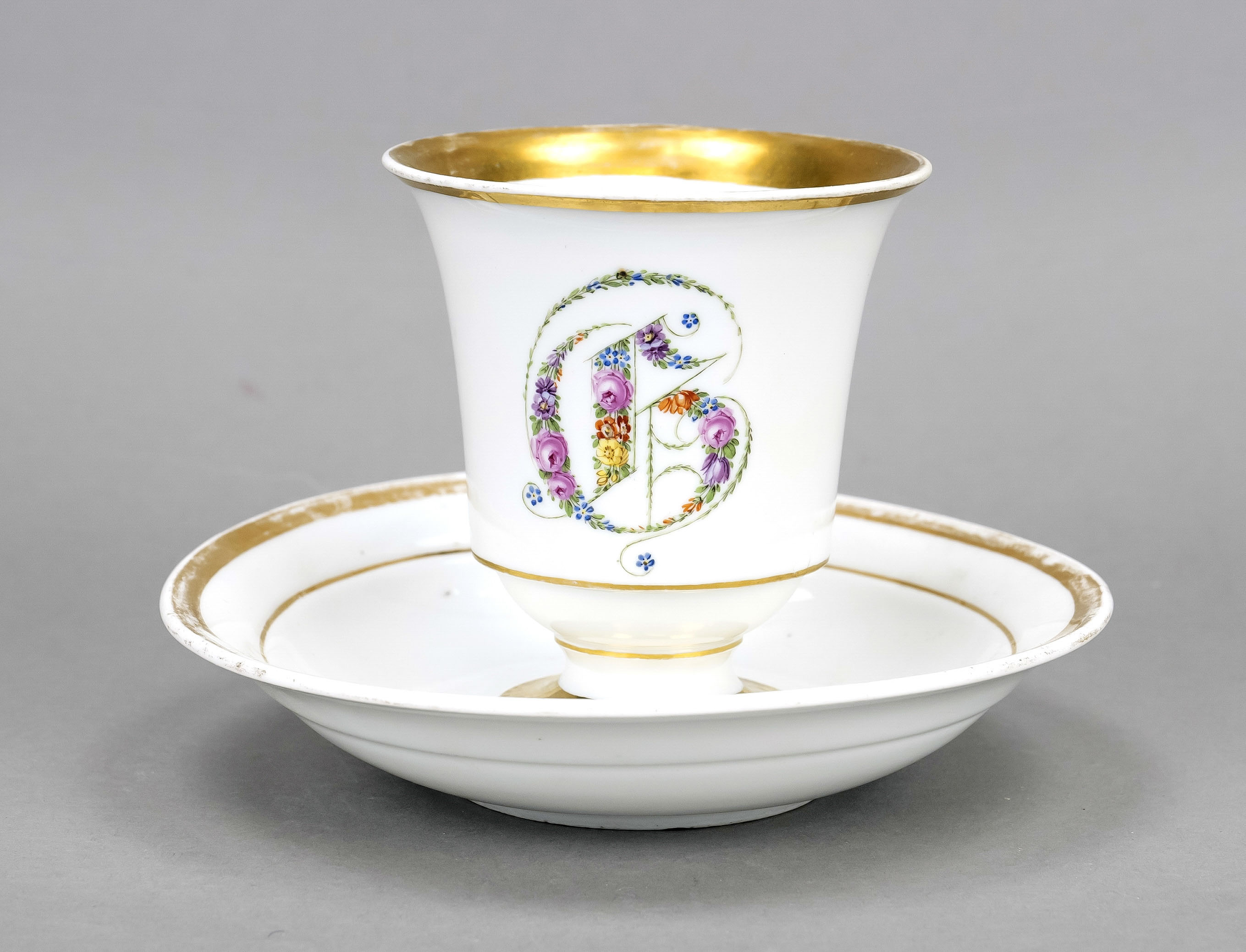 Cup and saucer, Meissen, 19th century, bell-shaped, polychrome flower painting on the front, forming