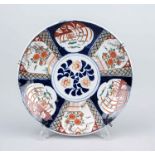 Imari plate, Japan, c. 1900, decoration under and on the glaze in cobalt blue, iron red and green.