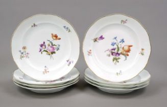 Eight dinner plates, 20th century, curved form with ogee rim, polychrome floral decoration, gold