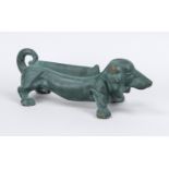 Shoe scraper in the shape of a dachshund, 20th century, cast iron, painted green, l. 38 cm